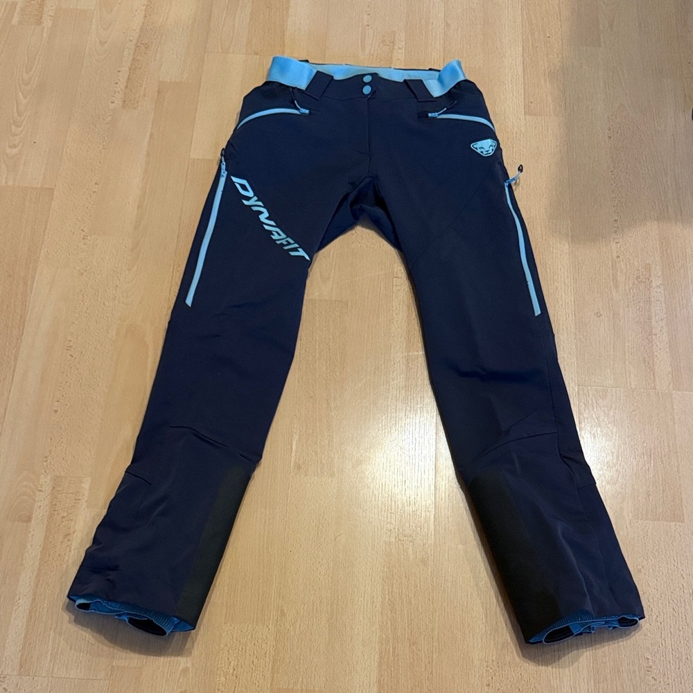 Dynafit Mercury Dynastretch ski touring pants in black with blue accents.
